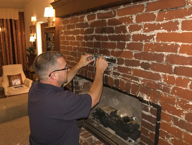 Miami Gardens Chimney Sweep expert fixing a fireplace in Miami Gardens, FL